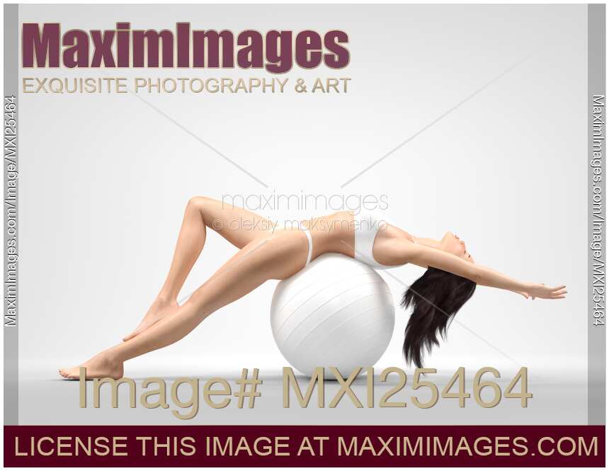 Young slim woman balancing on exercise ball