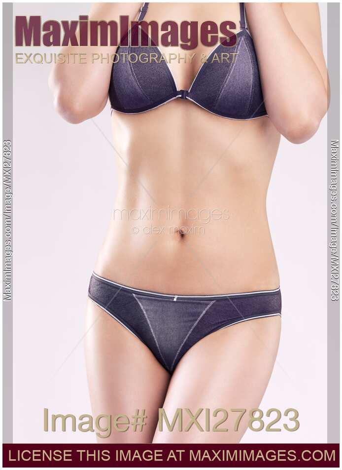 Young slim woman in blue underwear