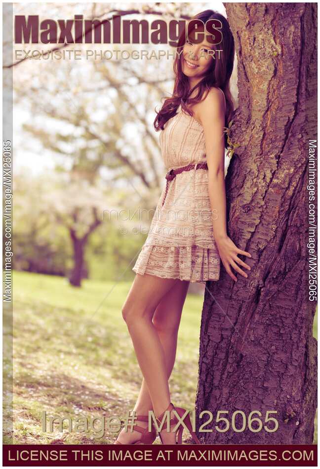Young Smiling Asian Woman in a Park