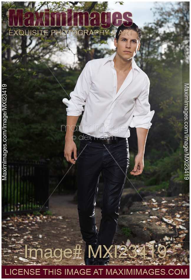 Young Stylish Man Walking in a Park
