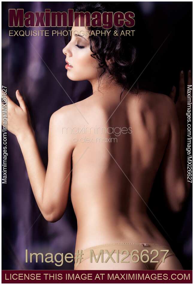 Young topless woman back