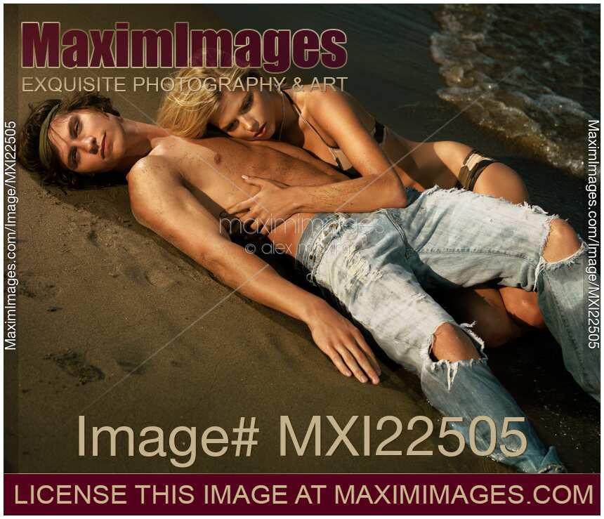 Young Woman and a Man Lying on the Shore