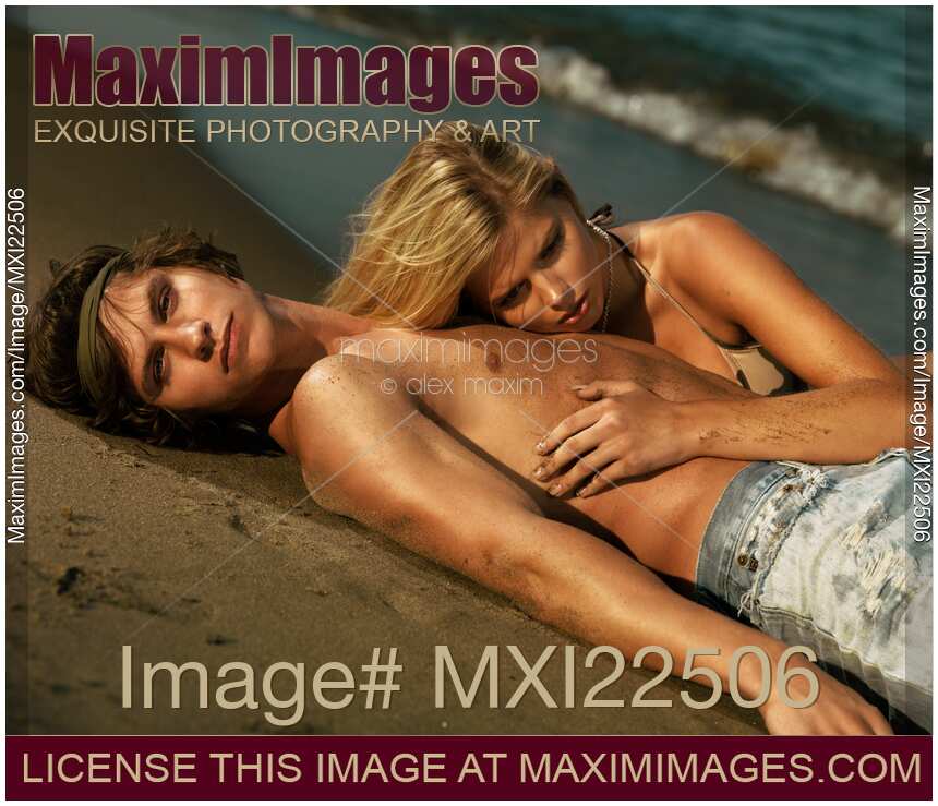 Young Woman and a Man Lying on the Shore