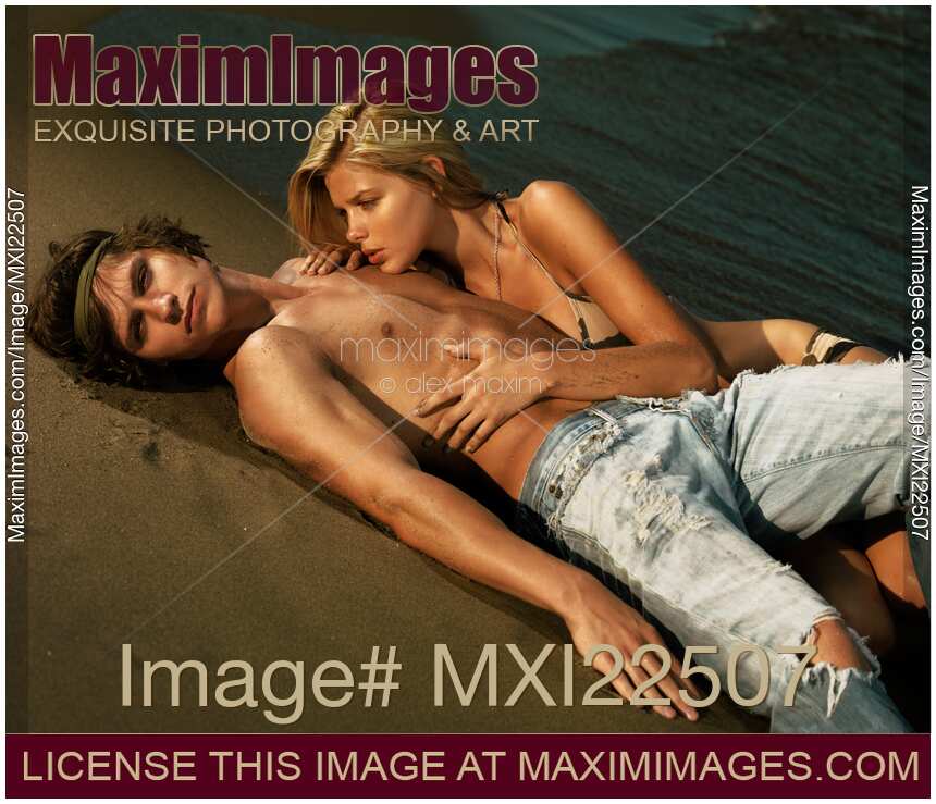 Young Woman and a Man Lying on the Shore
