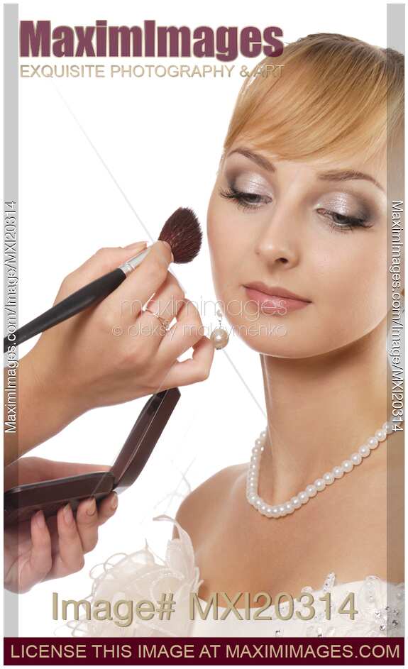 Young woman bride having makeup applied