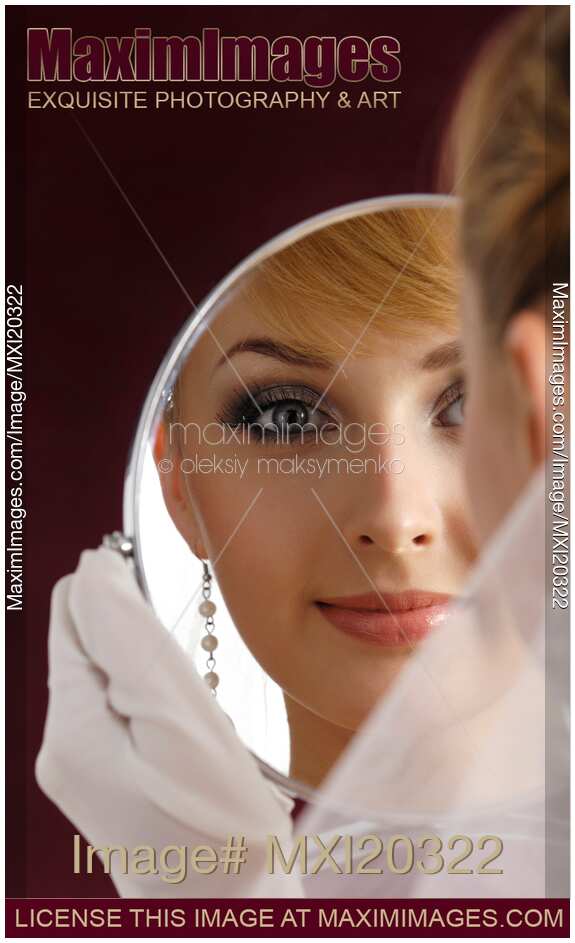 Young Woman Bride Looking in Mirror