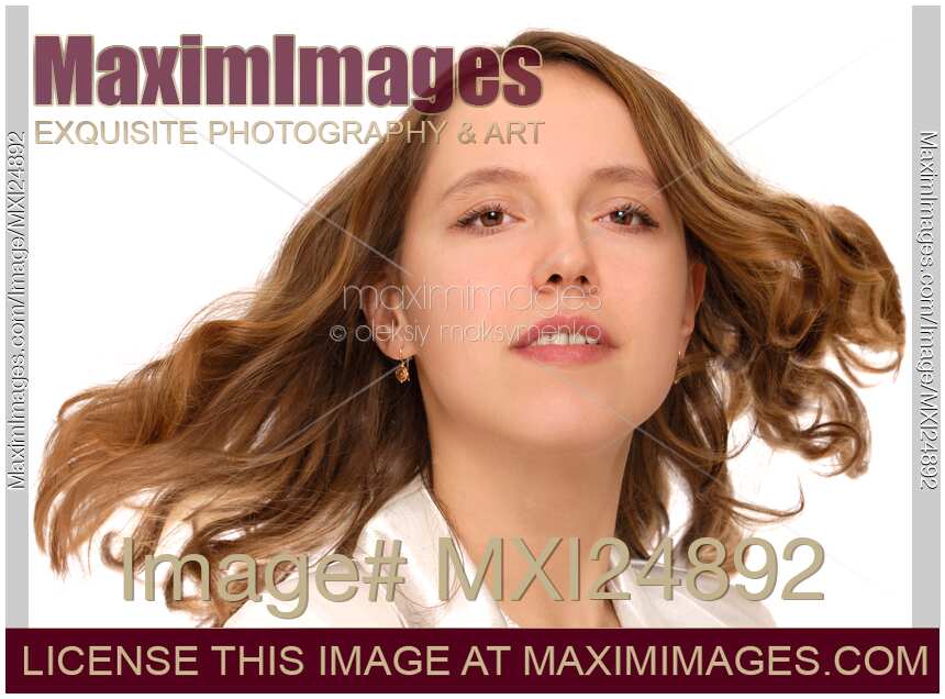Young woman face with long flying hair