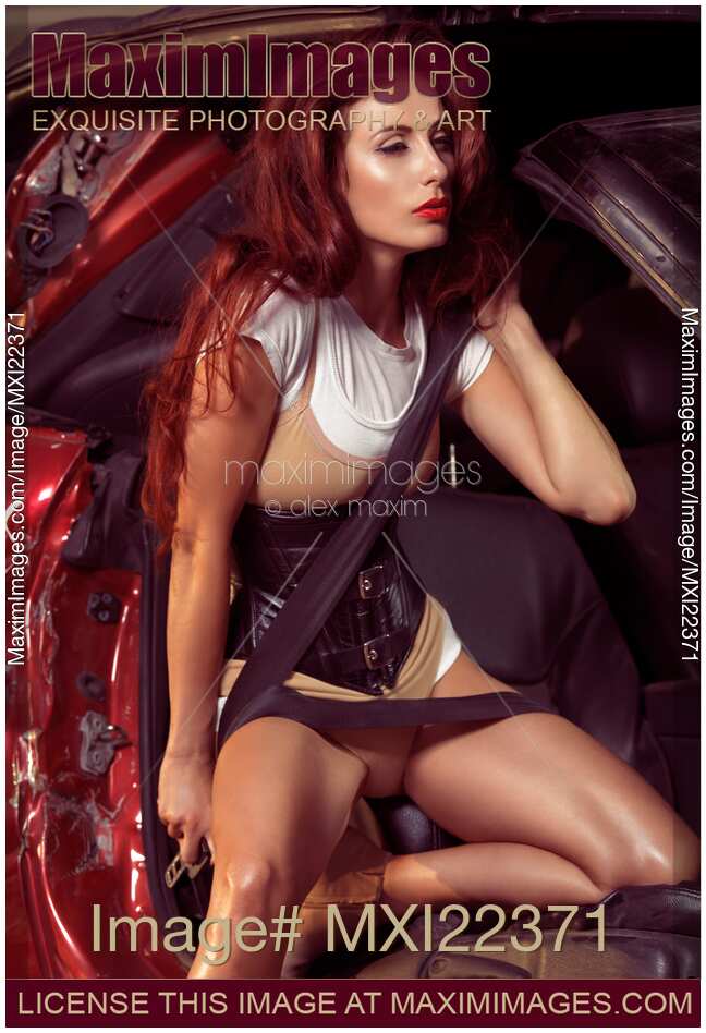 Young Woman in a Crashed Car