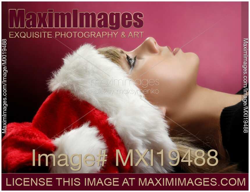 Young Woman in a Red Christmas Hat