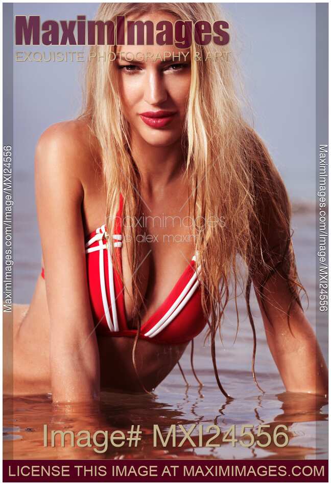 Young woman in bikini in water