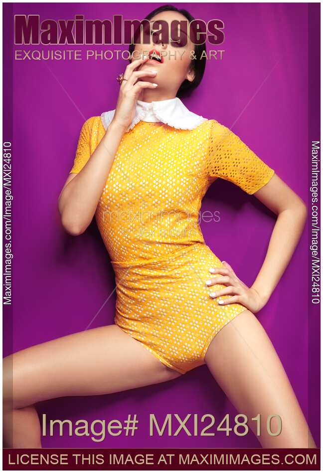 Young woman in bright yellow vintage style clothes