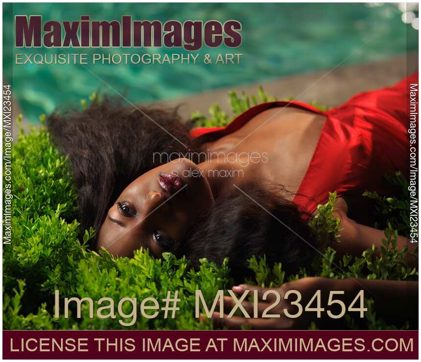 Young Woman in Red Dress at the Pool