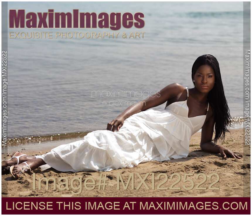 Young Woman In White Dress on the Beach