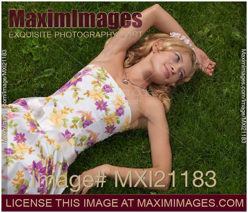 Young Woman Lying on Grass