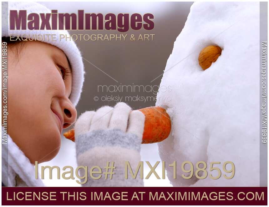 Young Woman Making Snowman