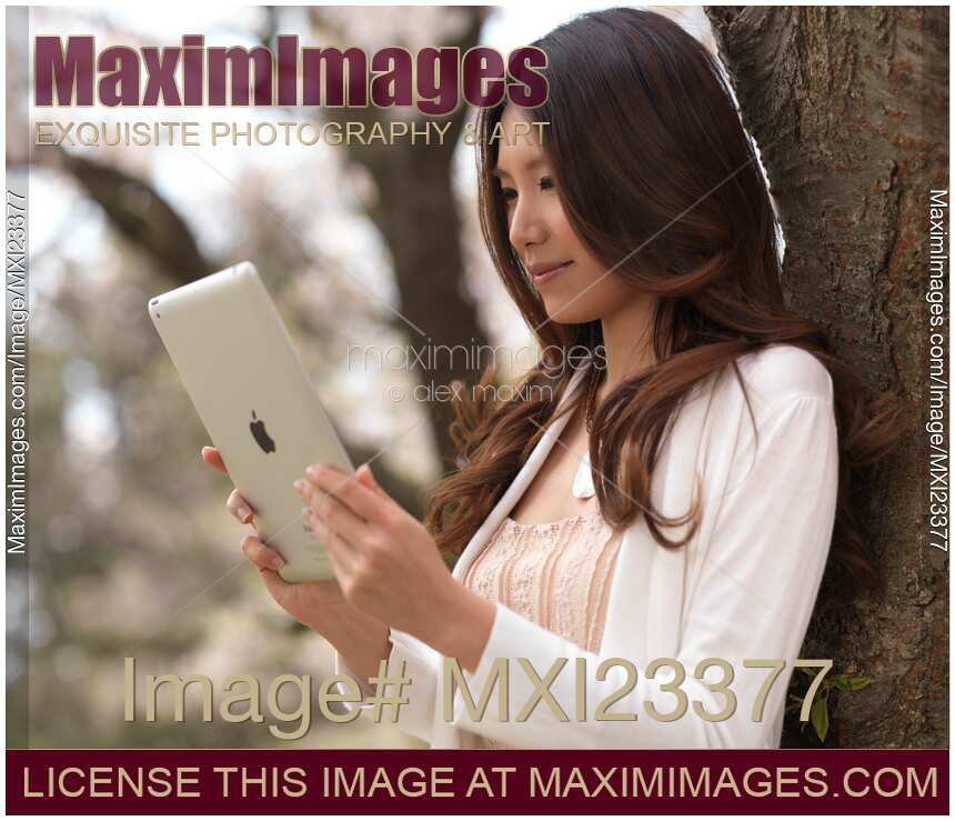 Young Woman Outdoors with iPad