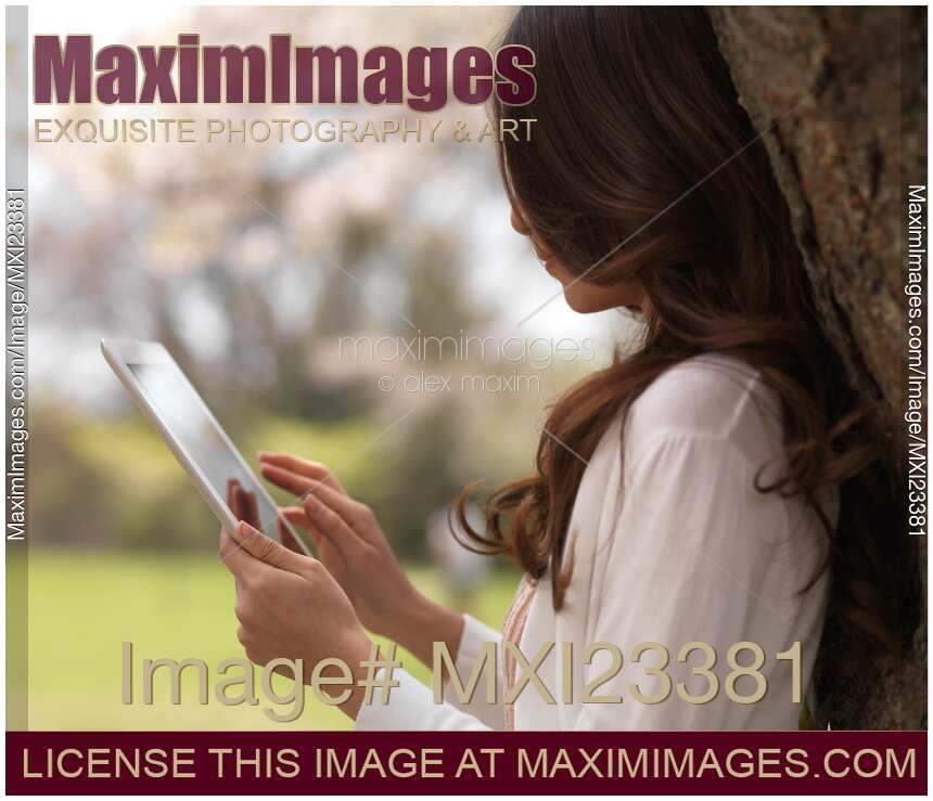 Young Woman Outdoors with iPad