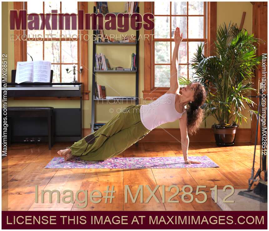 Young woman practicing yoga indoors