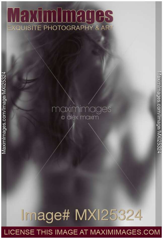 Young woman trapped behind glass