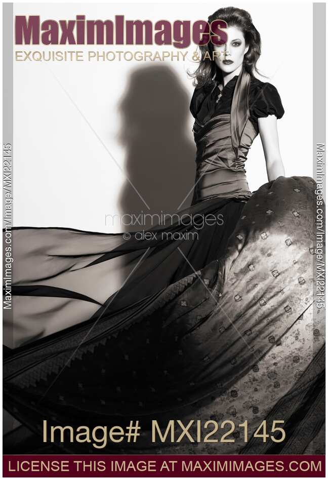 Young Woman Wearing a Long Flying Dress