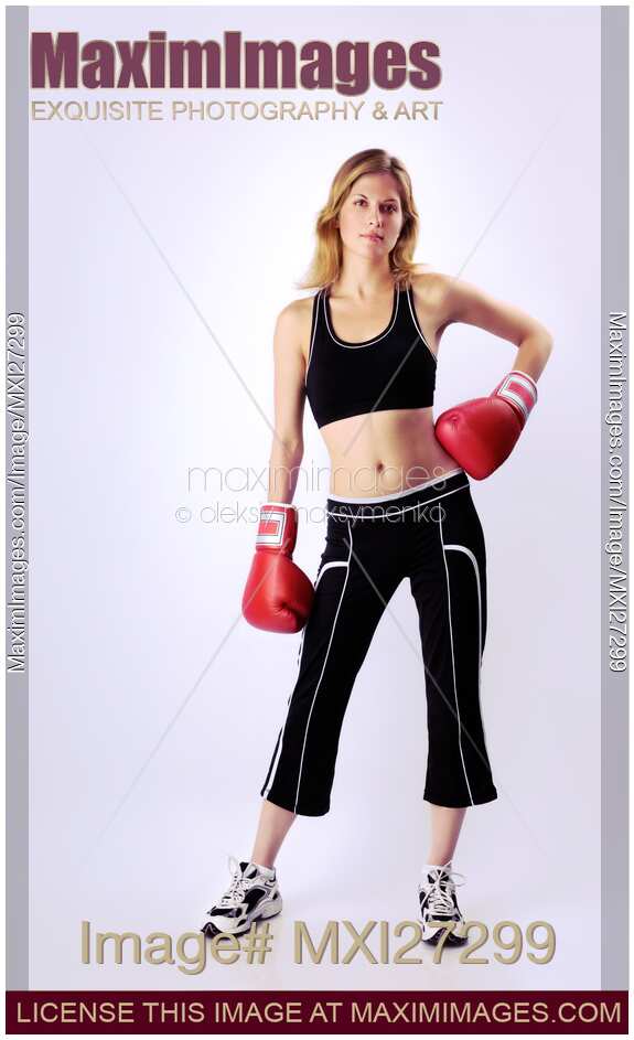 Young woman wearing boxing gloves