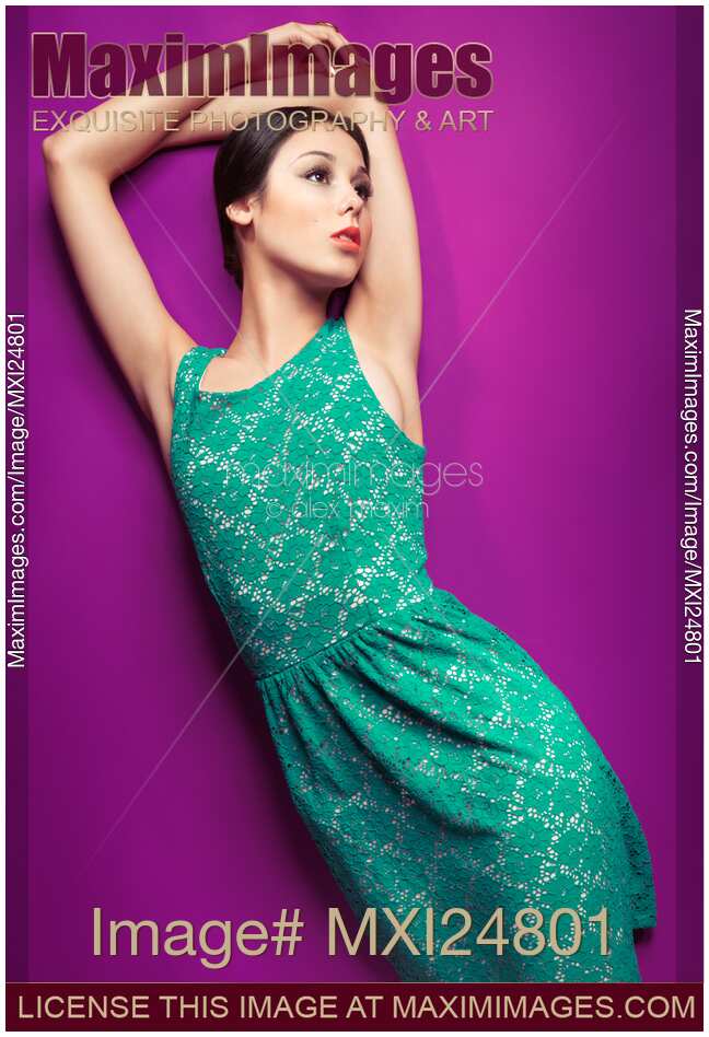 Young woman wearing green vintage style dress