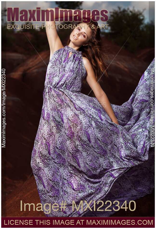 Young Woman Wearing Long Flare Dress