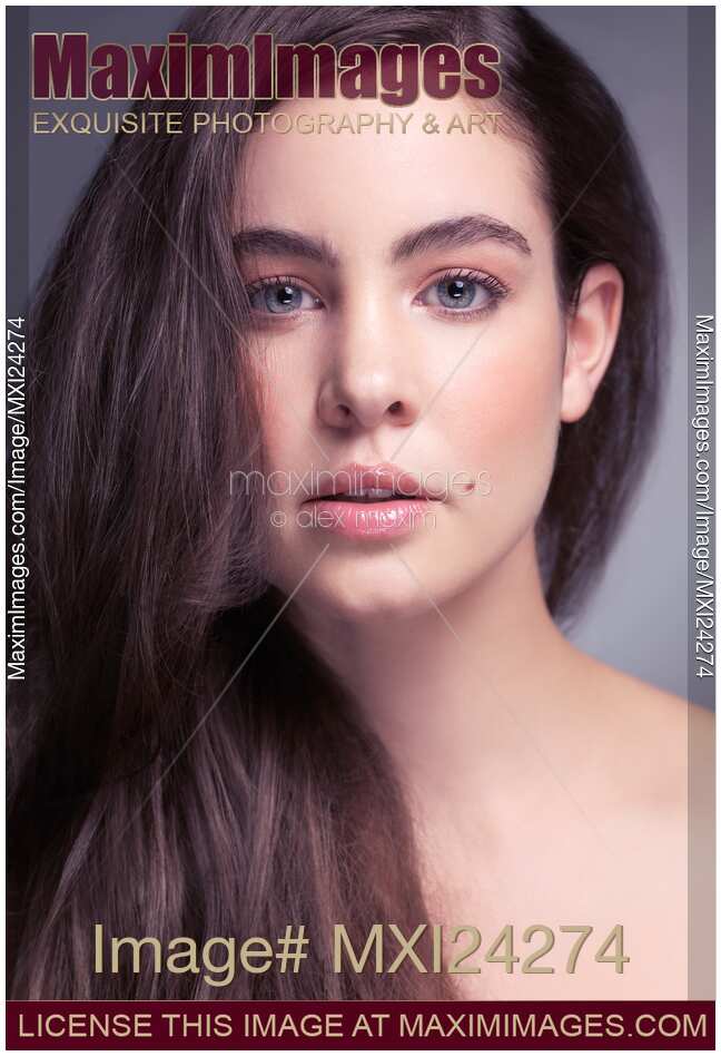 Young woman with gray eyes beauty portrait