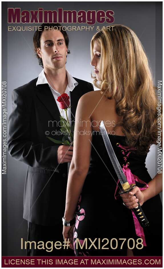 Young woman with knife planning to kill a man