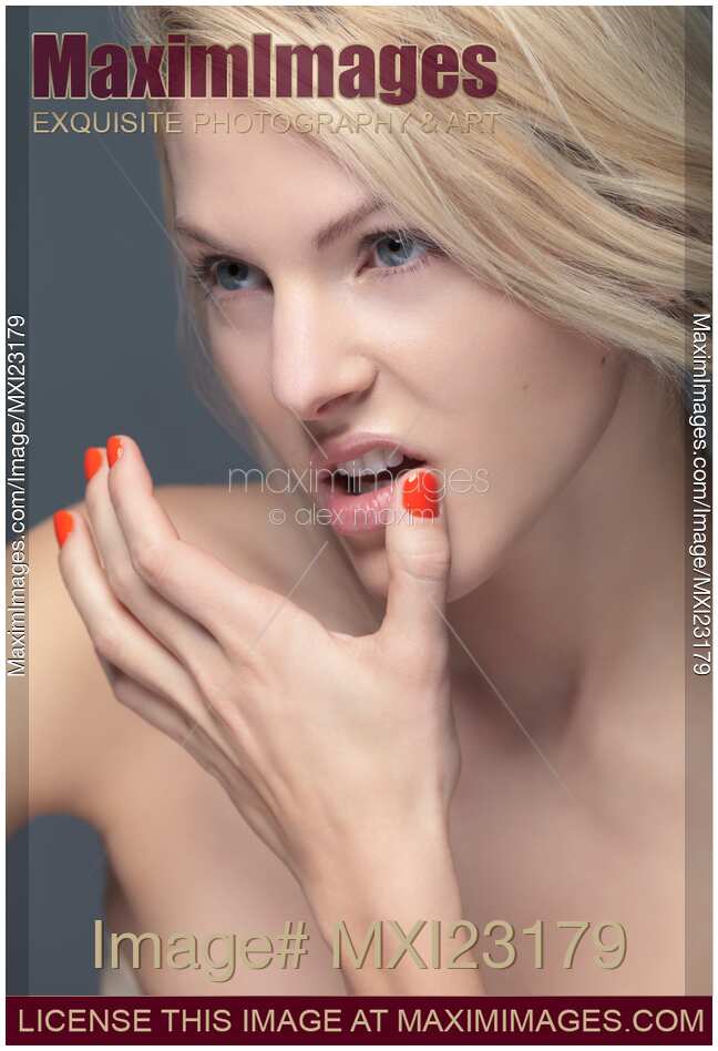 Young Woman with Orange Nail Polish