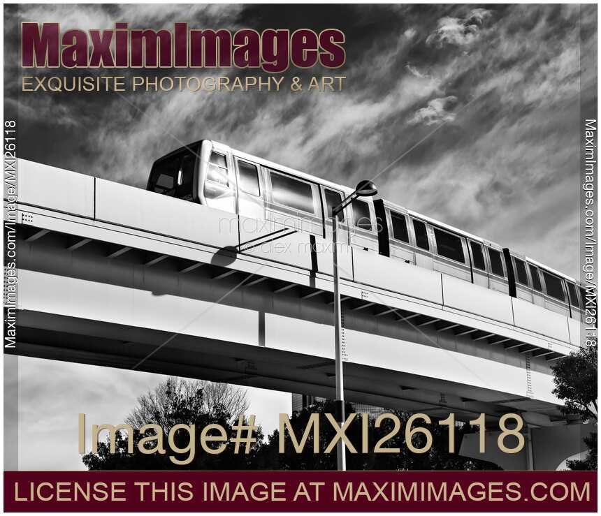 Yurikamome train on elevated railway in Odaiba Tokyo Black and white