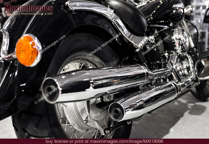 Stock photo of Chromed motorcycle mufflers Buy commercial use license at MaximImages