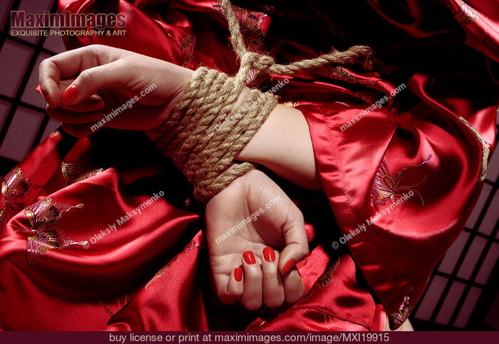 Stock photo of Woman with Her Hands Tied Behind Her Back Buy commercial use license at MaximImages