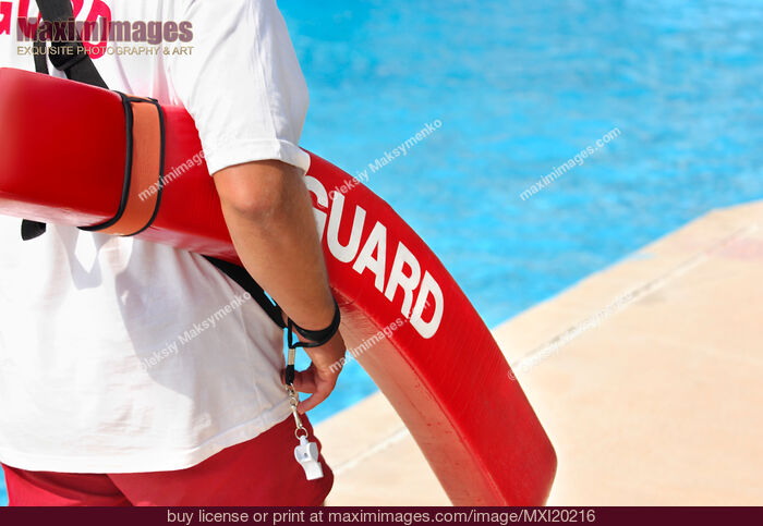 Stock photo of Lifeguard on duty at a pool Buy commercial use license at MaximImages