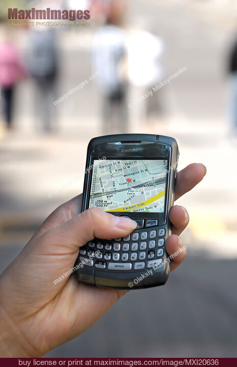 Stock photo of BlackBerry GPS Smartphone in a hand Buy commercial use license at MaximImages
