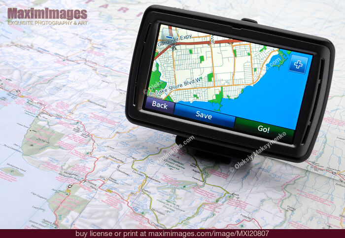 Stock photo of Automotive GPS on a road map Buy commercial use license at MaximImages