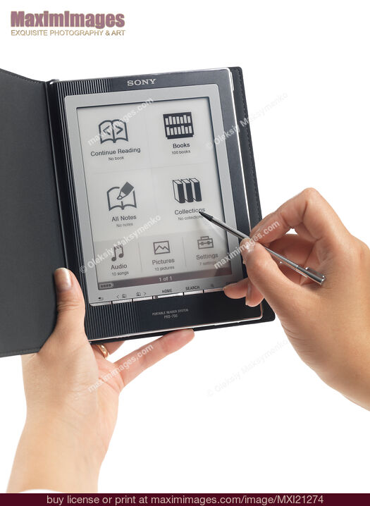 Stock photo of Woman Using Sony Reader Buy commercial use license at MaximImages