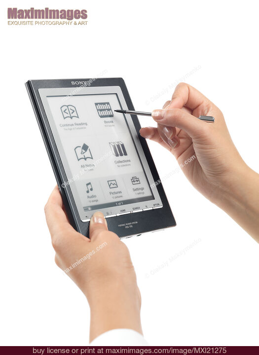 Stock photo of Woman Using Sony Reader Buy commercial use license at MaximImages
