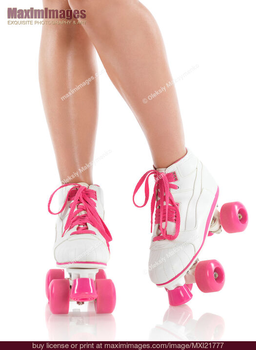 Stock photo of Young Woman Wearing Roller Derby Skates Buy commercial use license at MaximImages