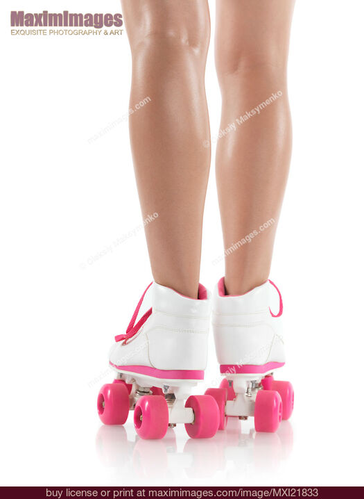 Stock photo of Young Woman Wearing Roller Derby Skates Buy commercial use license at MaximImages