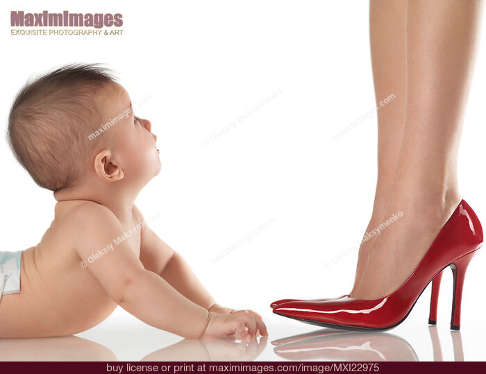 Stock photo of Baby Looking up at His Dressed up Mother Buy commercial use license at MaximImages