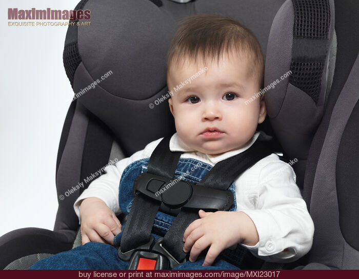 Baby in a Booster Seat. Stock Photo MXI23017