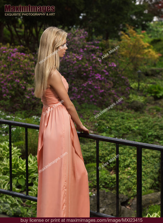 Stock photo of Young Woman in a Garden Buy commercial use license at MaximImages