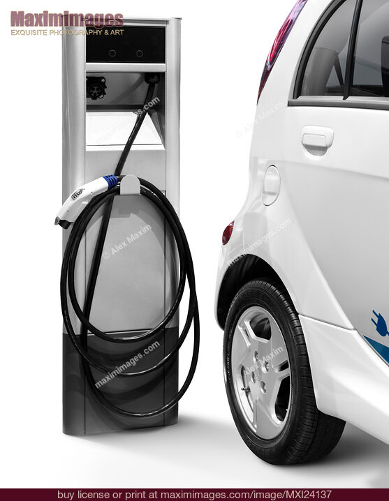 Stock photo of Electric car at a charging station Buy commercial use license at MaximImages