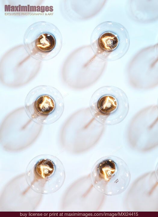Lit incandescent tungsten light bulbs. Stock Photo MXI24415