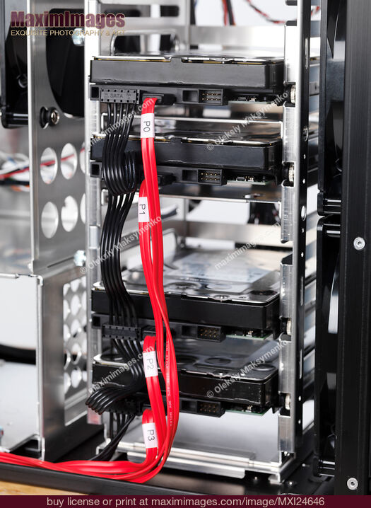 Stock photo of Hard drives in HDD bay Buy commercial use license at MaximImages