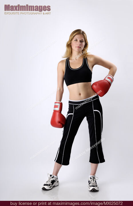 Stock photo of Young Woman Kickboxer Buy commercial use license at MaximImages