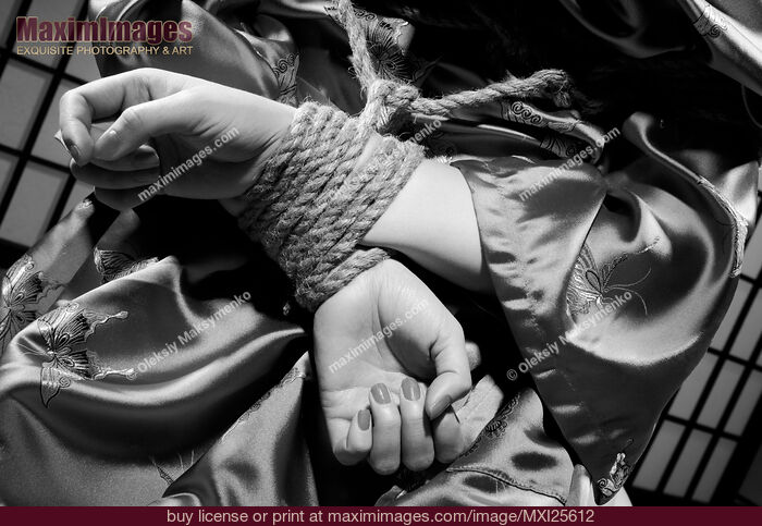 Stock photo of Woman with Her Hands Tied Behind Her Back Black and white Buy commercial use license at MaximImages