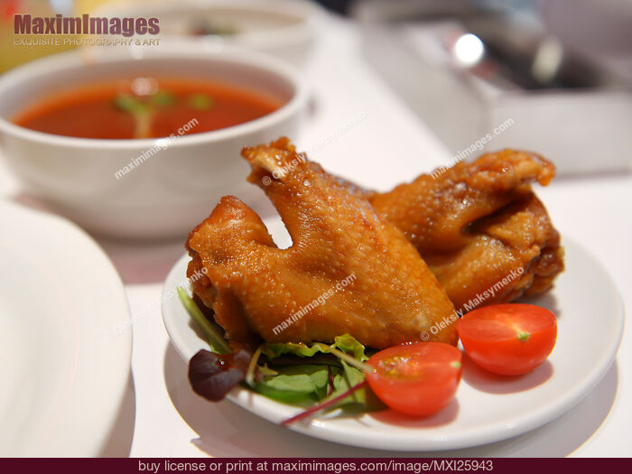 Stock photo of Chicken wings on a plate Buy commercial use license at MaximImages