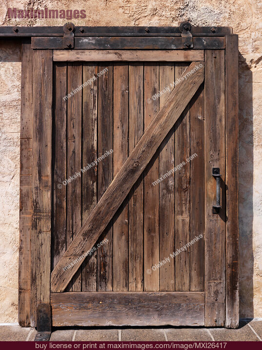 Stock photo of Old sliding wooden door texture Buy commercial use license at MaximImages
